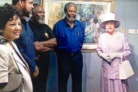 Joe pictured with Queen Elizabeth at a impromptu audience during one of her visits to Jamaica